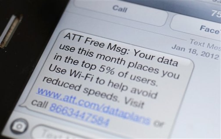 This Feb. 10 photo shows screen on a smartphone showing a text message to an AT&T customer, in New York.